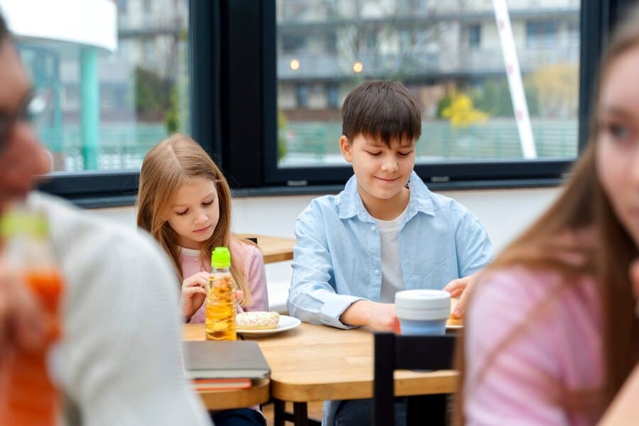 students-having-lunch-canteen_23-2149402897